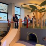 Minister cutting ribon