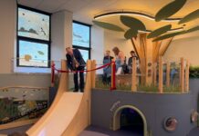 Minister cutting ribon