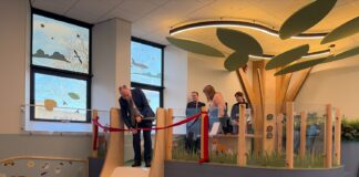 Minister cutting ribon