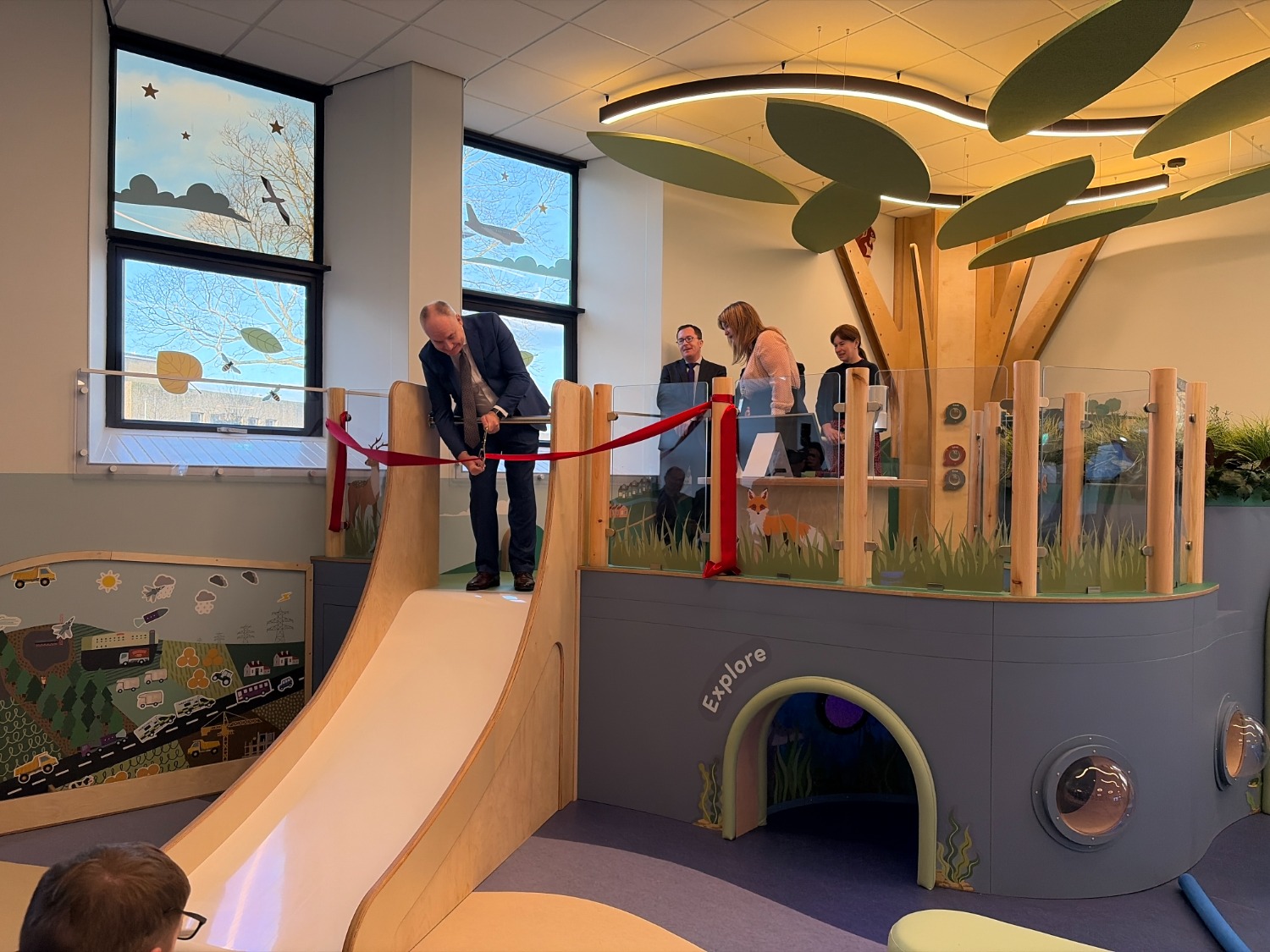 Minister cutting ribon