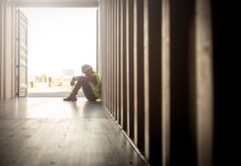 Stressed despair staff in logistic business sittng in container box at shipyard