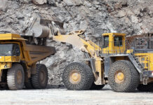 Mineral products being loaded into construction equipment