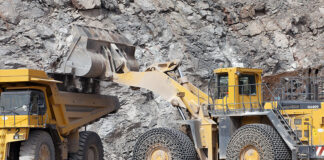 Mineral products being loaded into construction equipment