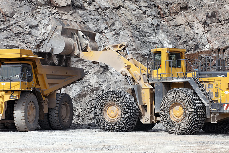 Mineral products being loaded into construction equipment