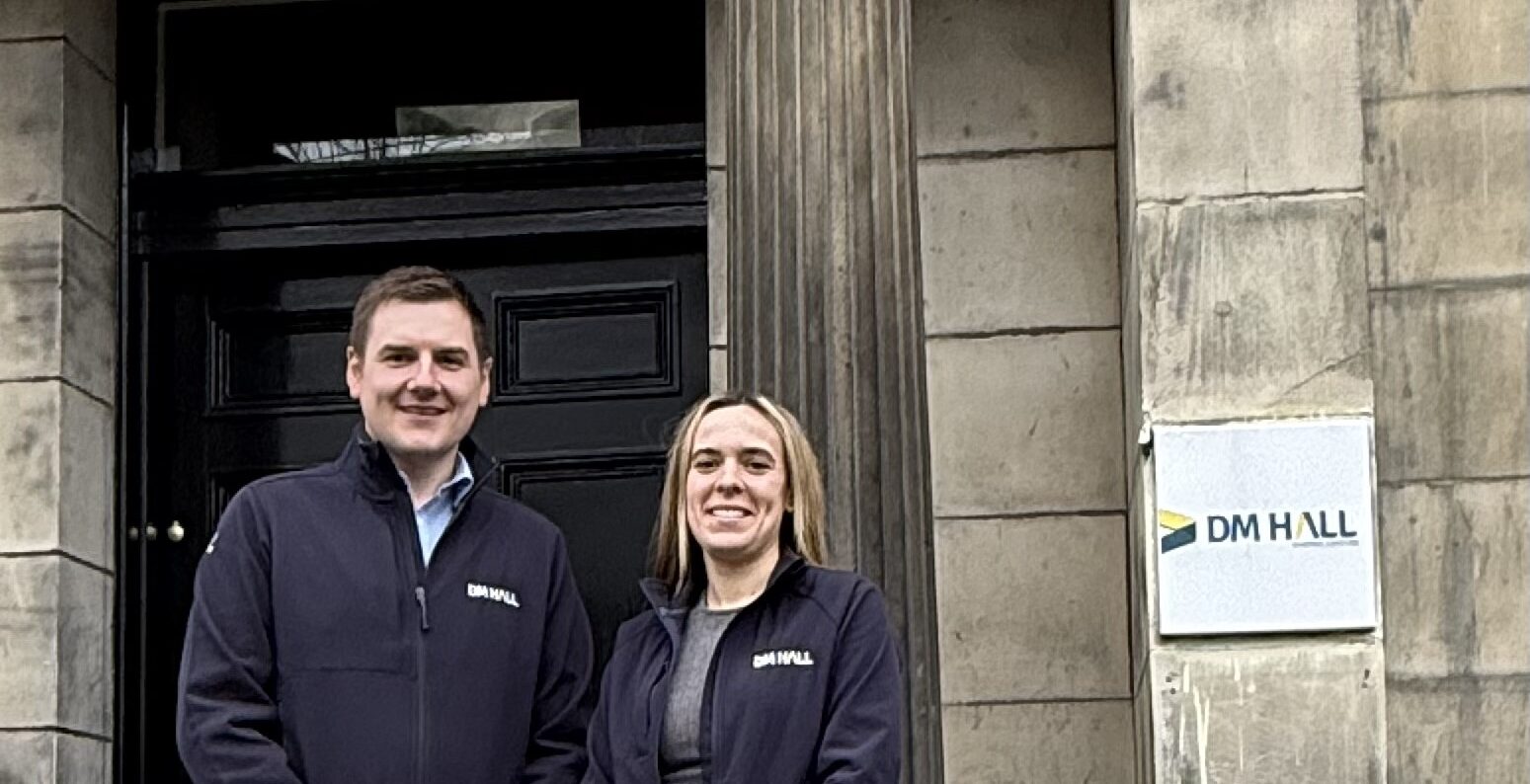 Chris Stark and Morgan Smith outside DM Hall office