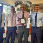 John Mooney presented with gift on his retirement