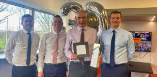 John Mooney presented with gift on his retirement