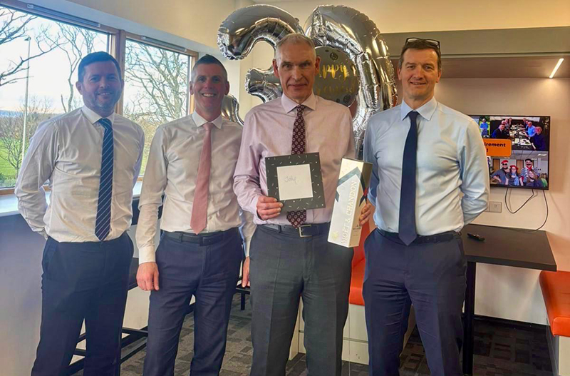 John Mooney presented with gift on his retirement