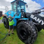 Construction machine being cleaned