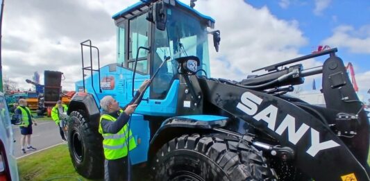 Construction machine being cleaned