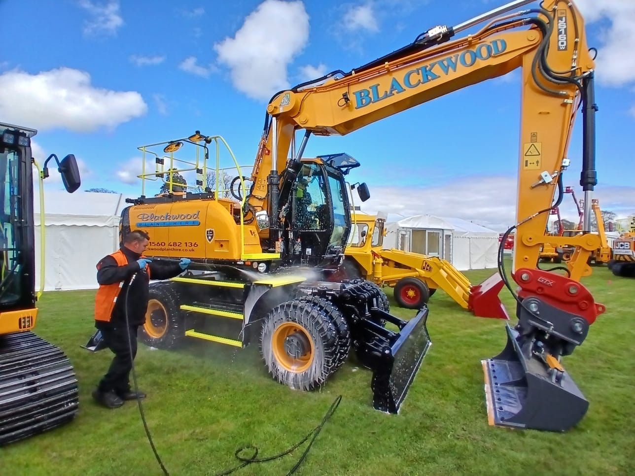 Construction machine being cleaned