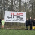 Electrical and mechanical specialist nets museum tickets for West Lothian charity John Heaney (Electrical) Ltd MD Mark Heaney with young footballers