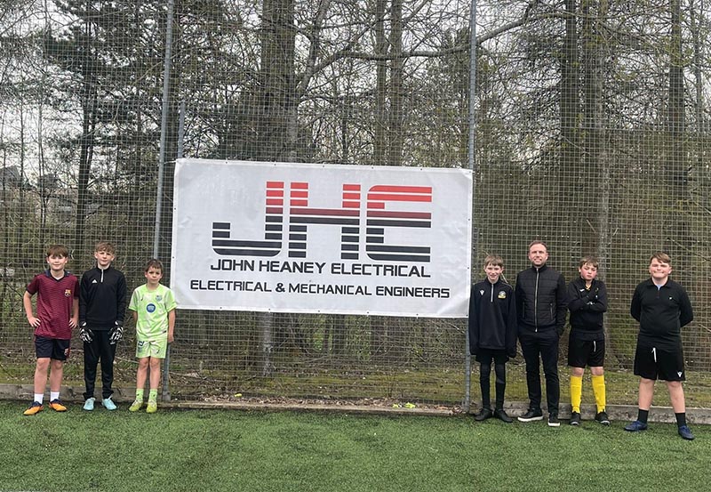 John Heaney (Electrical) Ltd MD Mark Heaney with young footballers