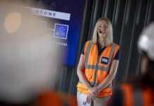 Delivering Growth in Scotland women in hi-vis vest