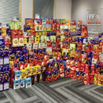 Bellway MD Fraser Conn and office manager Claire Hornal with Easter eggs to be donated