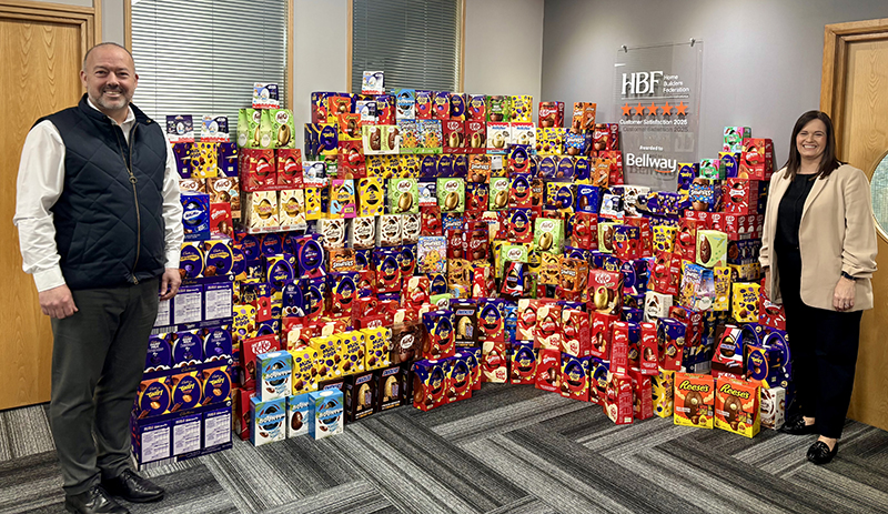 Bellway MD Fraser Conn and office manager Claire Hornal with Easter eggs to be donated