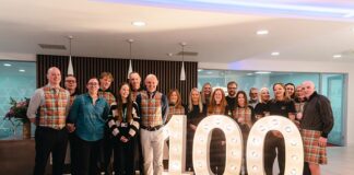 Mactaggart and Mickel team gathering to mark reaching the £100,000 fundraising target