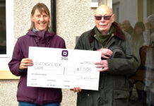 Gillian Smith (QCCC) and Ian Crawford (Manor Estates) with big cheque handover