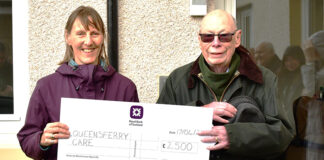 Gillian Smith (QCCC) and Ian Crawford (Manor Estates) with big cheque handover