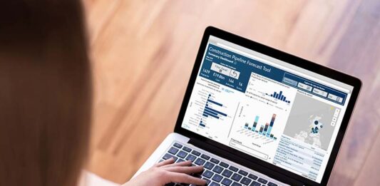 Laptop with construction pipeline website page open