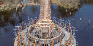 Hundreds of larch trees were felled by hand to meet the requirements of the crannog reconstruction. Image: Andrew Allan
