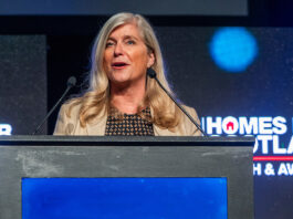 Scottish housing leaders to hear of urgent need for leadership and action Jane Wood at podium