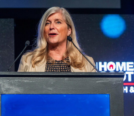 Scottish housing leaders to hear of urgent need for leadership and action Jane Wood at podium