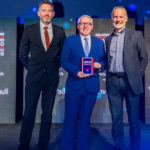 Bracewell earns award recognition for collaborative approach Bracewell on stage receiving award
