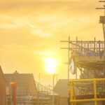 Construction bosses urged to revise cooling strategies ahead of summer months Construction site with sun in background