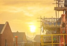 Construction bosses urged to revise cooling strategies ahead of summer months Construction site with sun in background