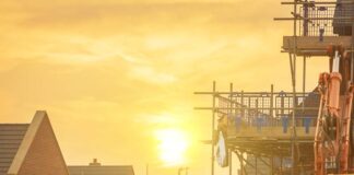 Construction site with sun in background