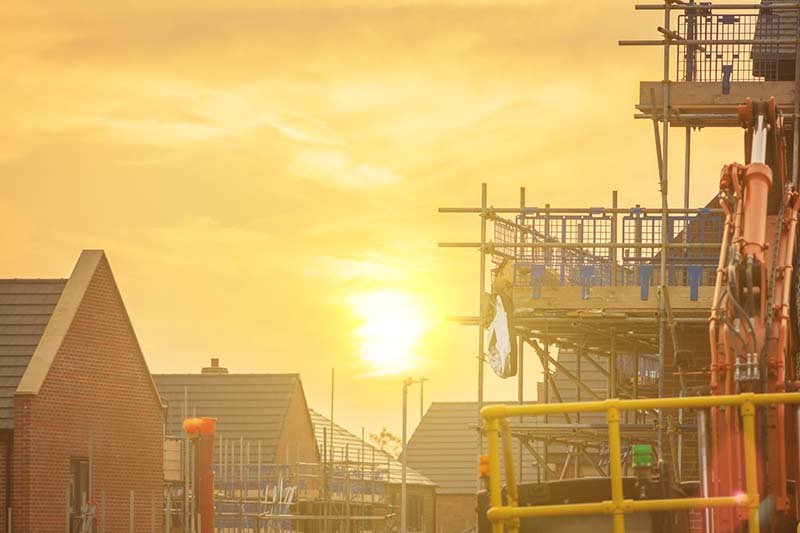 Construction site with sun in background