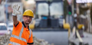 Construction worker managing traffic