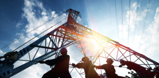 silhouette workers on background of construction