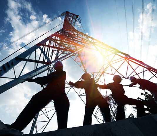 Scotland’s construction leaders state key aims for incoming government silhouette workers on background of construction