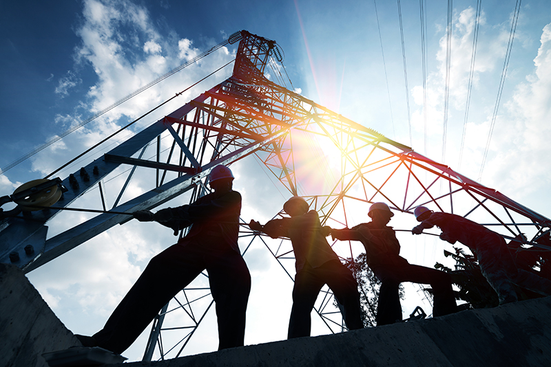 silhouette workers on background of construction
