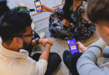 Apprentices looking at phone app