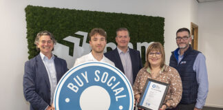 Representatives from BAM with Buy Social Pledge logo