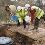 Workers at rainwater harvesting system