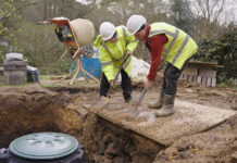 Workers at rainwater harvesting system