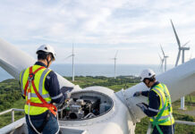 Cross-skill wind programme launched to support transition of technicians Engineers inspecting wind turbine components