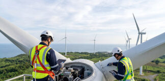 Engineers inspecting wind turbine components