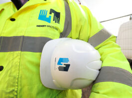 Construction worker with Henry Brothers branding