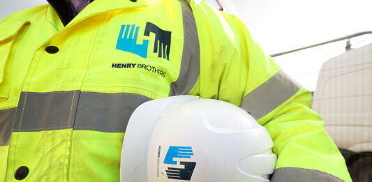 Henry Brothers strengthens Scottish presence with new Edinburgh base Construction worker with Henry Brothers branding