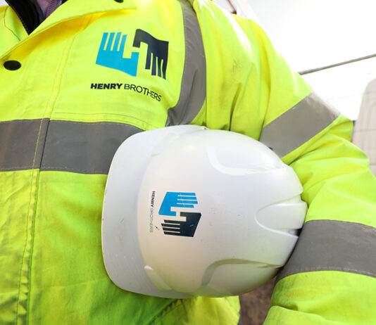 Henry Brothers strengthens Scottish presence with new Edinburgh base Construction worker with Henry Brothers branding