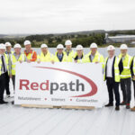 Topping out ceremony marks construction milestone at new AIC Heating base Topping out ceremony at new AIC Heating UK base in Lochgelly