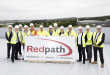 Topping out ceremony marks construction milestone at new AIC Heating base Topping out ceremony at new AIC Heating UK base in Lochgelly