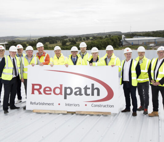 Topping out ceremony marks construction milestone at new AIC Heating base Topping out ceremony at new AIC Heating UK base in Lochgelly