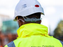 Tilbury Douglas grows order book to £1.7 billion in first half of 2026 Construction worker with Tilbury Douglas jacket